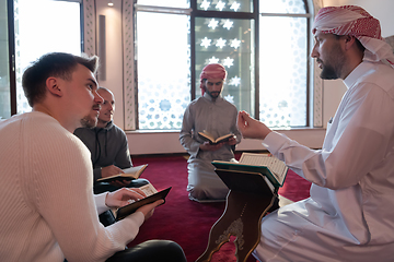 Image showing muslim people in mosque reading quran together