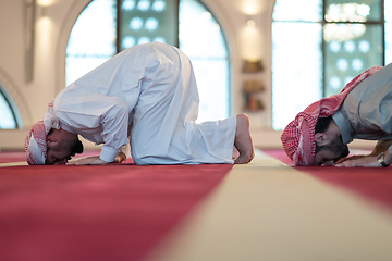 Image showing group of muslim people praying namaz in mosque.