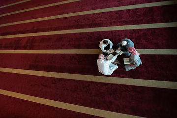 Image showing muslim people in mosque reading quran together