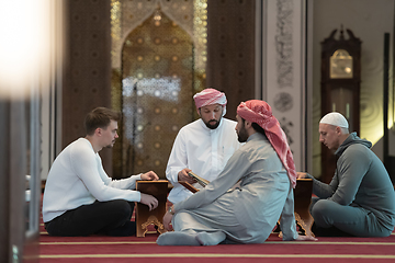 Image showing muslim people in mosque reading quran together