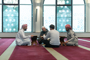 Image showing muslim people in mosque reading quran together