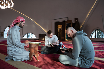 Image showing muslim people in mosque reading quran together