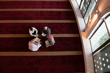 Image showing muslim people in mosque reading quran together