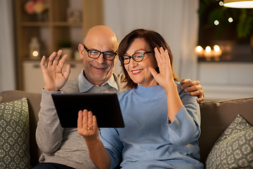 Image showing old couple with tablet pc has video call at home