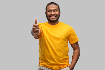 Image showing smiling african american man showing thumbs up