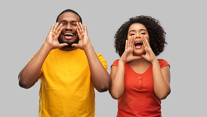 Image showing happy african american couple calling