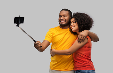 Image showing african american couple taking selfie by cellphone