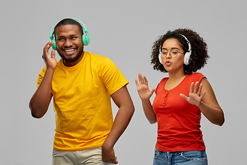 Image showing african american couple with headphones dancing