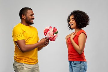 Image showing happy african american couple with flowers