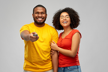 Image showing african american couple with tv remote control