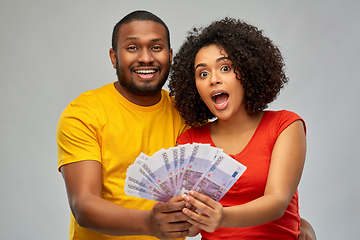 Image showing happy african american couple with euro money