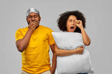Image showing african couple with eye sleeping mask and pillow