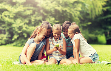 Image showing kids or friends with smartphone in summer park