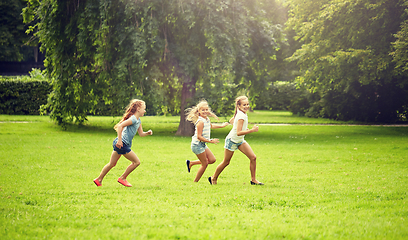 Image showing happy kids running and playing game outdoors