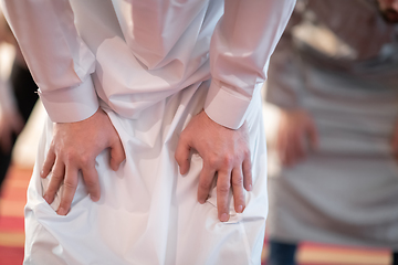 Image showing group of muslim people praying namaz in mosque.