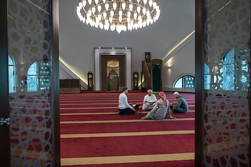 Image showing muslim people in mosque reading quran together