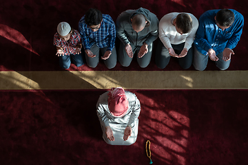 Image showing group of muslim people praying namaz in mosque.