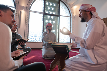 Image showing muslim people in mosque reading quran together