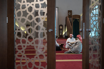 Image showing muslim people in mosque reading quran together