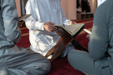 Image showing muslim people in mosque reading quran together