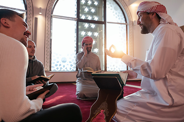 Image showing muslim people in mosque reading quran together