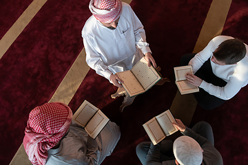 Image showing muslim people in mosque reading quran together