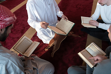 Image showing muslim people in mosque reading quran together