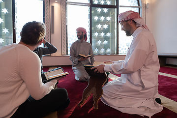 Image showing muslim people in mosque reading quran together