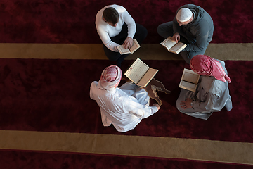 Image showing muslim people in mosque reading quran together