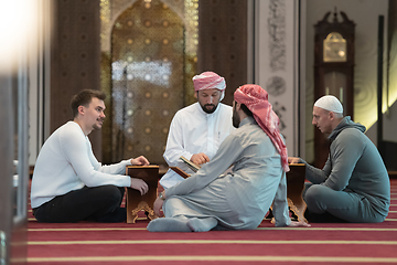 Image showing muslim people in mosque reading quran together