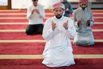 Image showing group of muslim people praying namaz in mosque.