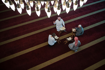 Image showing muslim people in mosque reading quran together