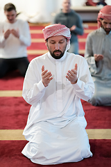 Image showing group of muslim people praying namaz in mosque.