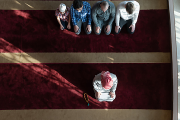 Image showing group of muslim people praying namaz in mosque.