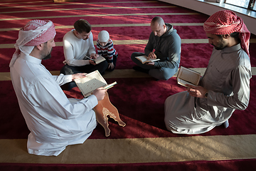 Image showing muslim people in mosque reading quran together