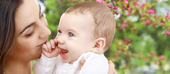 Image showing mother with baby over spring garden background