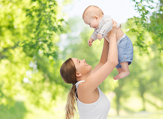 Image showing mother with baby over green natural background