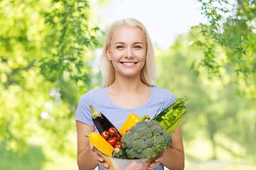 Image showing smiling young woman with vegetables