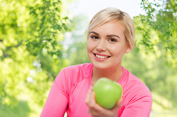 Image showing happy woman with green apple