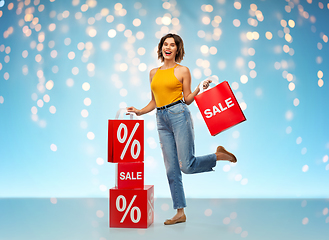 Image showing happy smiling young woman with shopping bags