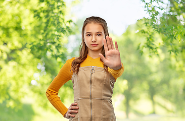 Image showing teenage girl making stopping gesture