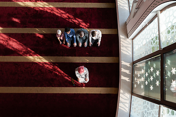 Image showing group of muslim people praying namaz in mosque.