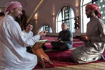 Image showing muslim people in mosque reading quran together