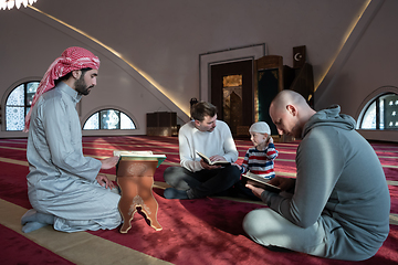 Image showing muslim people in mosque reading quran together