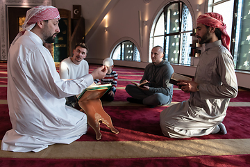 Image showing muslim people in mosque reading quran together