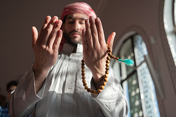 Image showing muslim prayer inside the mosque in namaz worship Allah