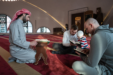 Image showing muslim people in mosque reading quran together