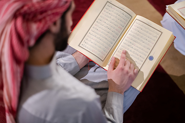 Image showing two muslim people in mosque reading quran together concept of islamic education