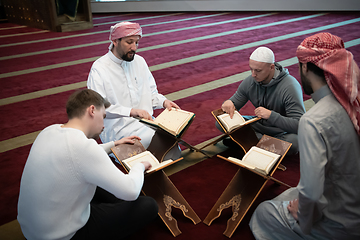 Image showing muslim people in mosque reading quran together