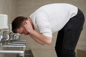 Image showing A Muslim takes ablution for prayer. Islamic religious rite